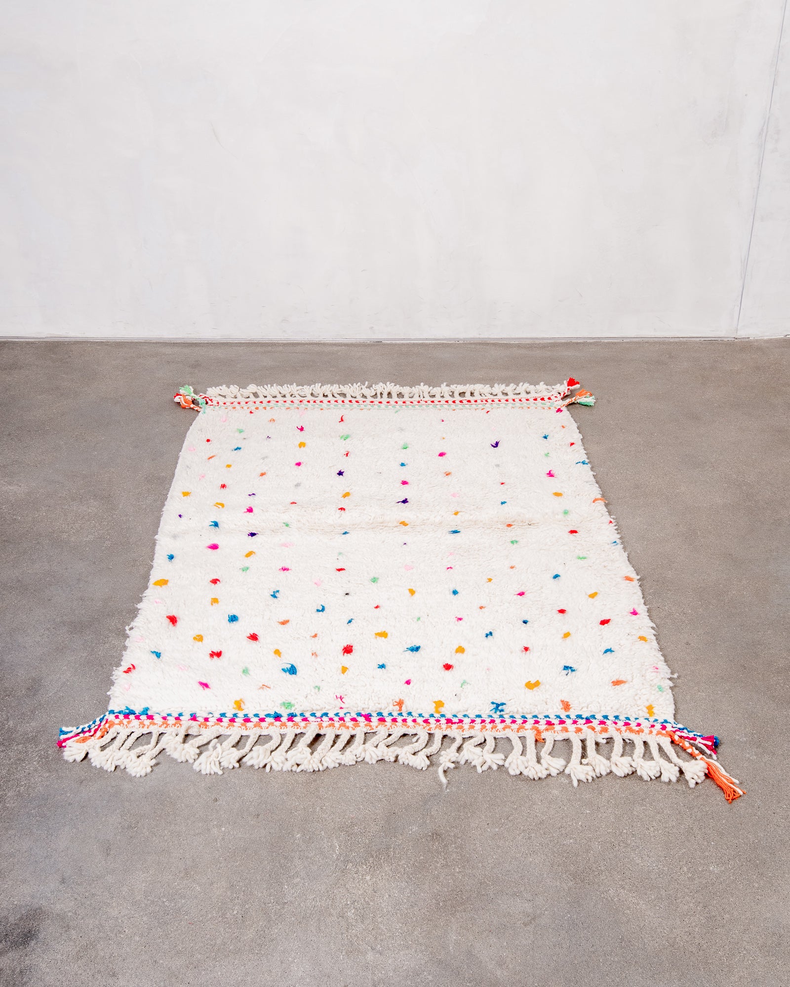 Modern, designer, handcrafted Berber rug from Morocco. Beniourain carpet with beautiful colours and patterns and fluffy wool texture.